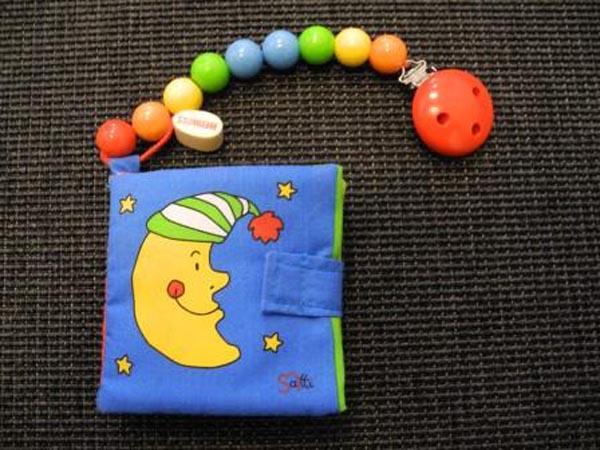 Soft book with soother holder