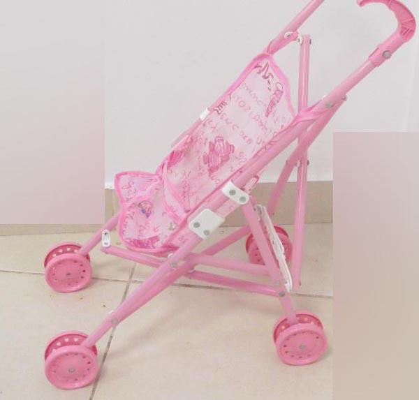 Doll with toy pushchair and rattle