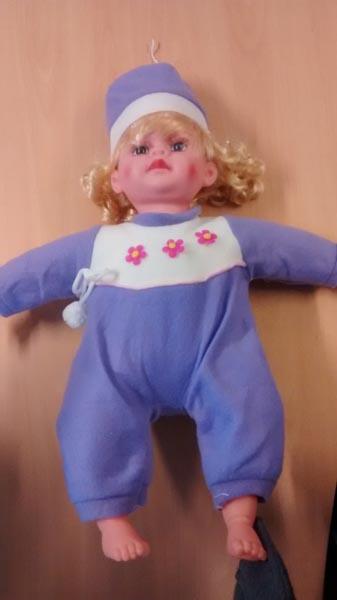 Plastic doll with voice box