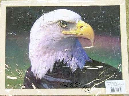 a) Wooden jigsaw puzzle (eagle) b) Wooden jigsaw puzzle (penguins)