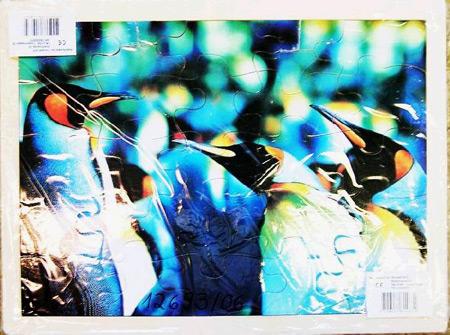 a) Wooden jigsaw puzzle (eagle) b) Wooden jigsaw puzzle (penguins)