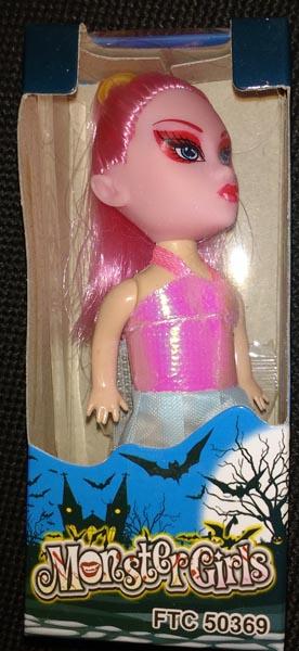 Plastic doll and sweets