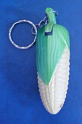 Novelty lighters: 1. corn-cob shaped lighter, 2. woman-shaped lighter