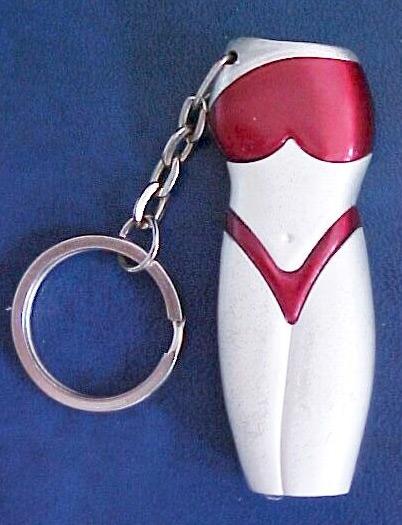 Novelty lighters: 1. corn-cob shaped lighter, 2. woman-shaped lighter