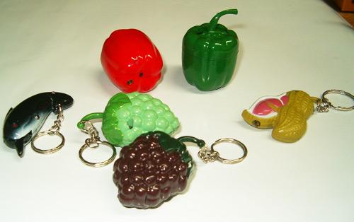 Novelty lighters: 1. red pepper, 2. green pepper, 3. dolphin, 4. green grape, 5. violet grape, 6. nut