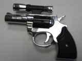 Lighter in the form of a revolver with laser pointer.