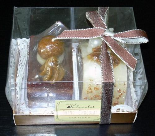 Candle imitating pastry of different shapes (roll, slices) with a chocolate scent