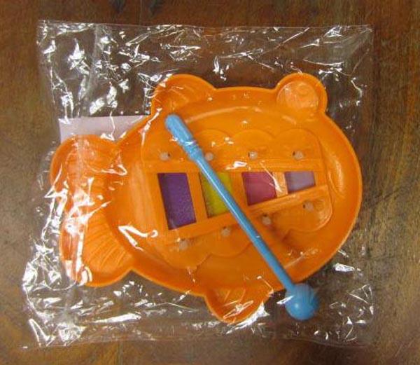 Plastic toy flower and xylophone