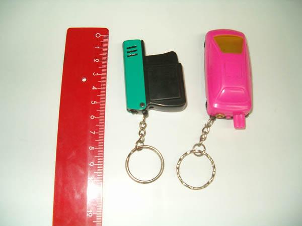 Metal novelty lighter in a shape of children's car and pistol