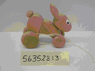 Pull-along toy – wooden hare on wheels.