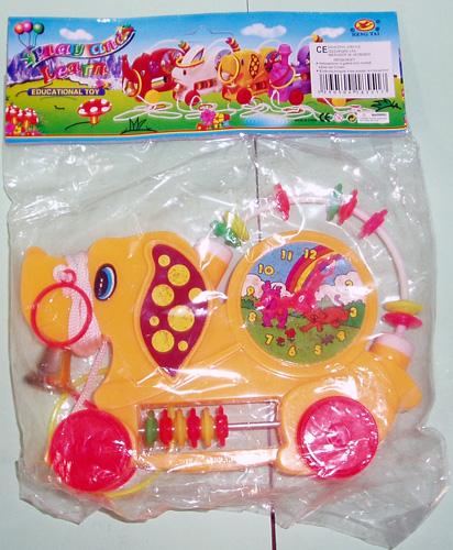 Educational toy - orange pull-along toy in the shape of a dog