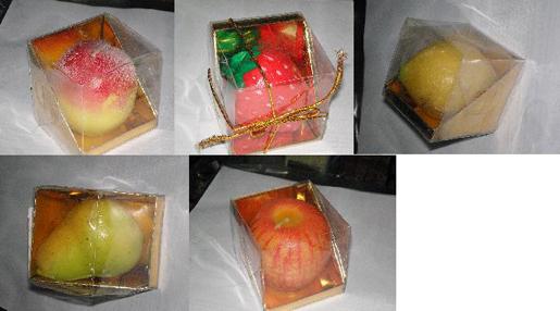 Candles in the shape of fruit (apple, strawberry, lemon, pear and peach)
