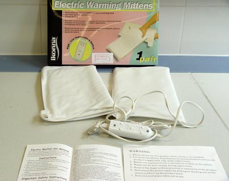Electric warming mittens used to dry nail varnish.