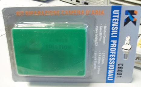 Bicycle repair kit - Rubber solution in a bicycle repair kit containing two tools