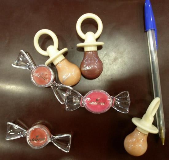 Lipsticks in the form of sweets and dummies.