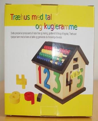 Wooden house with numbers and abacus