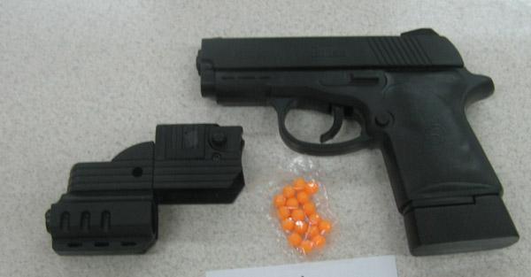 Toy ball gun with laser