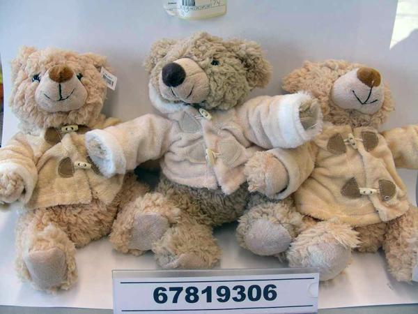 Teddy bear wearing coat