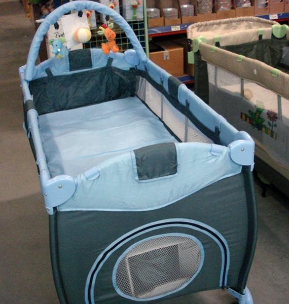Folding cot with changing unit