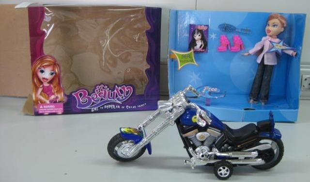 Doll with motorcycle