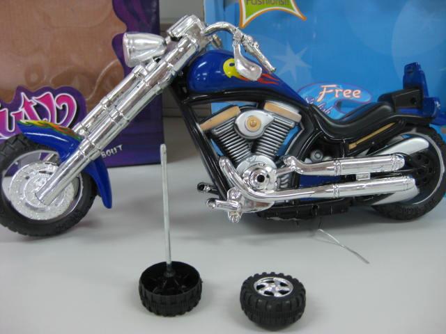 Doll with motorcycle