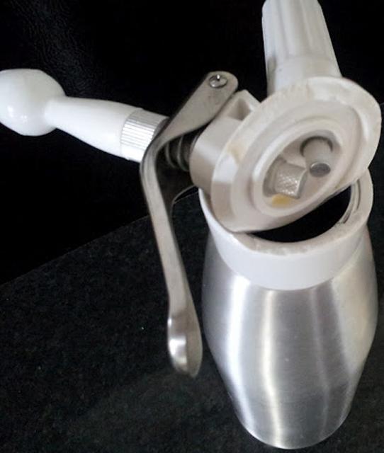 Whipped cream dispenser