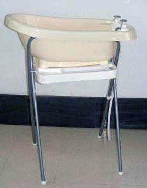 Child's bathtub with metal stand